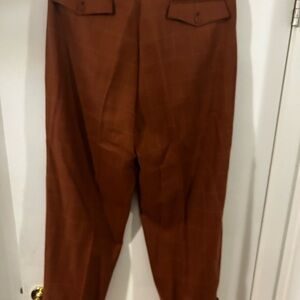 Men used dress pants in good condition color burnt orange with cream lines